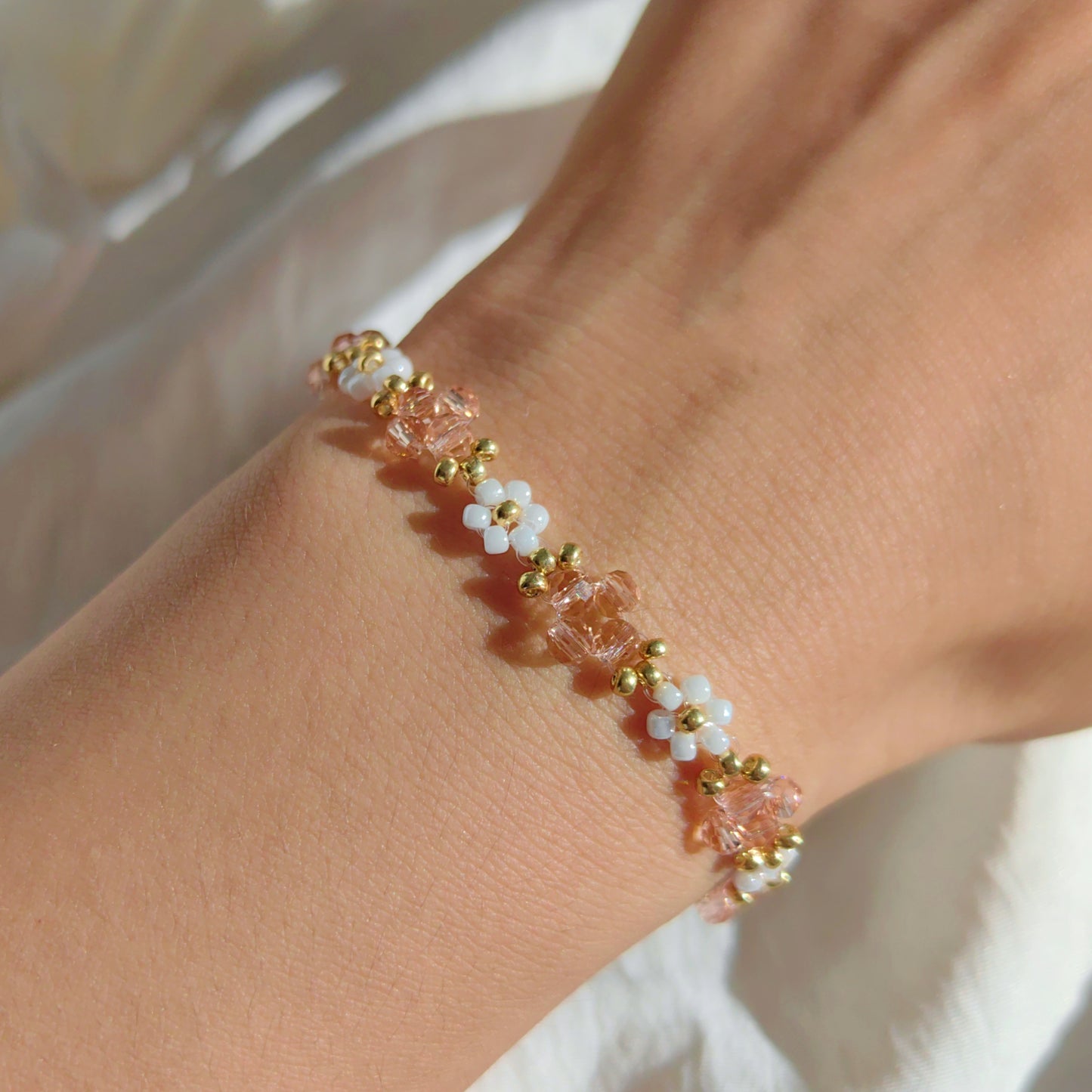 Soft pink Crystal & White Seed Bead Bracelet worn on wrist