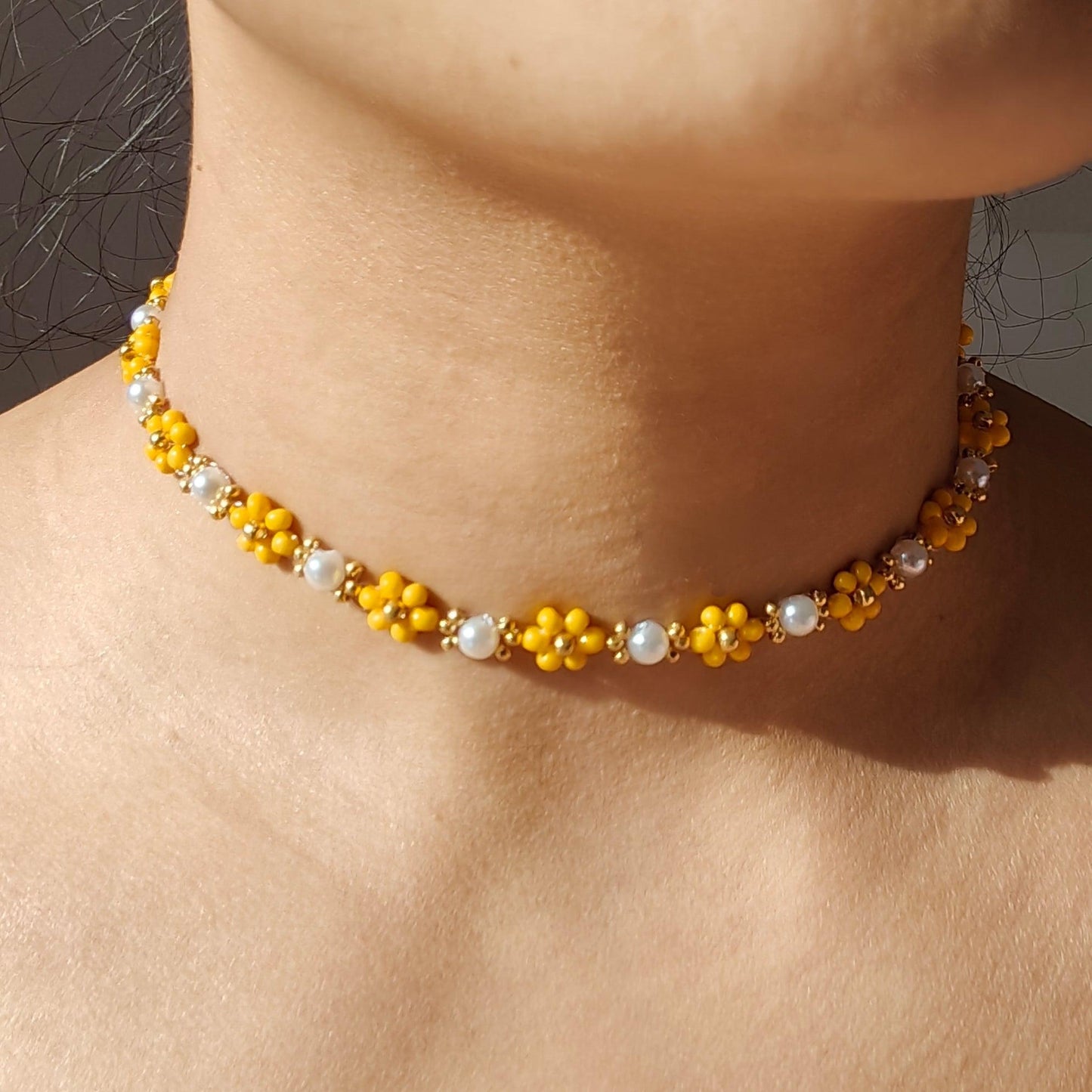 Dandelion Pearl Necklace with yellow seed beads and pearls worn on neck