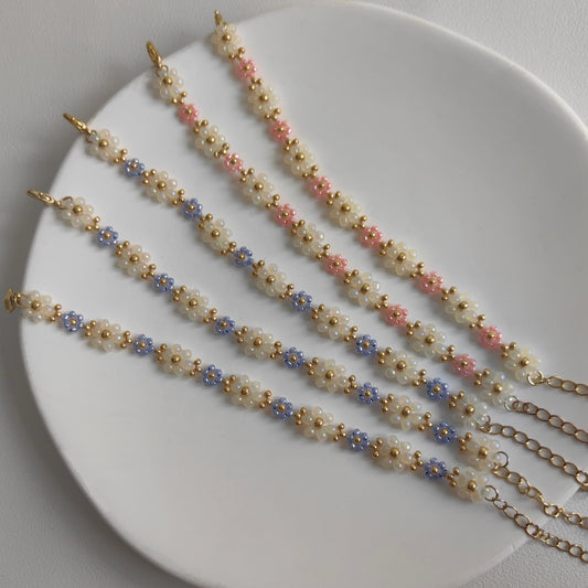 Pink and blue Blossom Beaded Bracelets displayed on white plate, handmade delicate seed bead bracelets