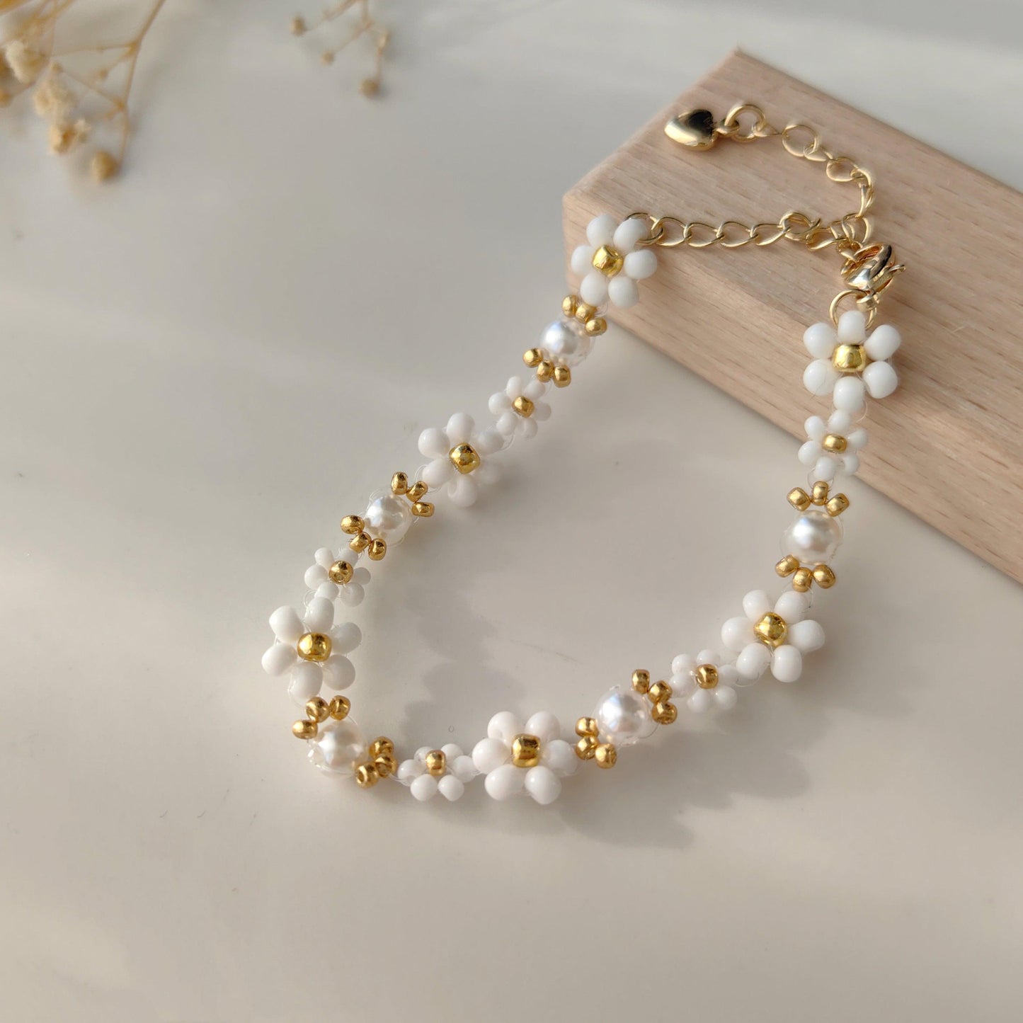 Cloud Pearl Bracelet displayed on wood, white seed bead and freshwater pearl bracelet