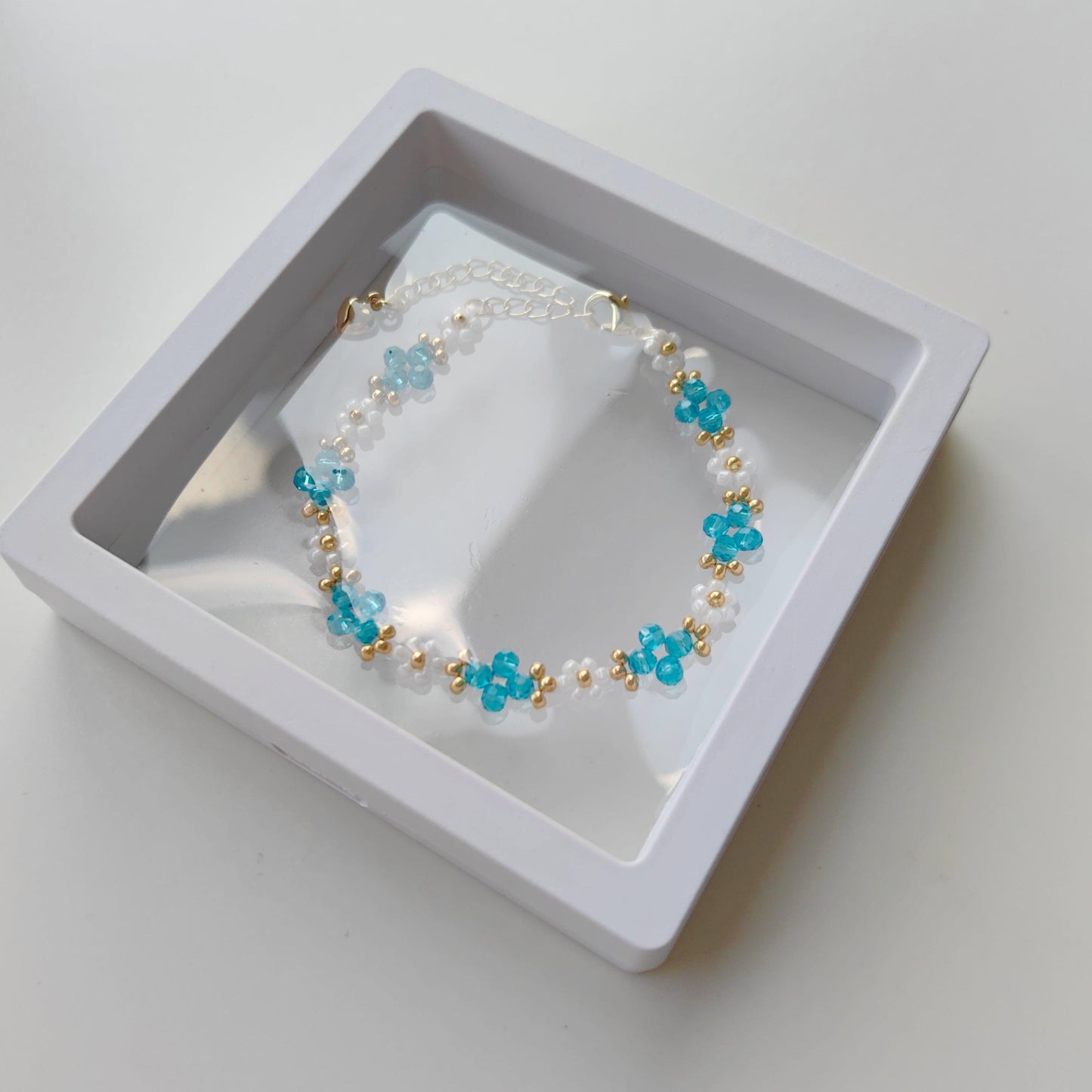 Lake blue Crystal & White Seed Bead Bracelet displayed in gift box