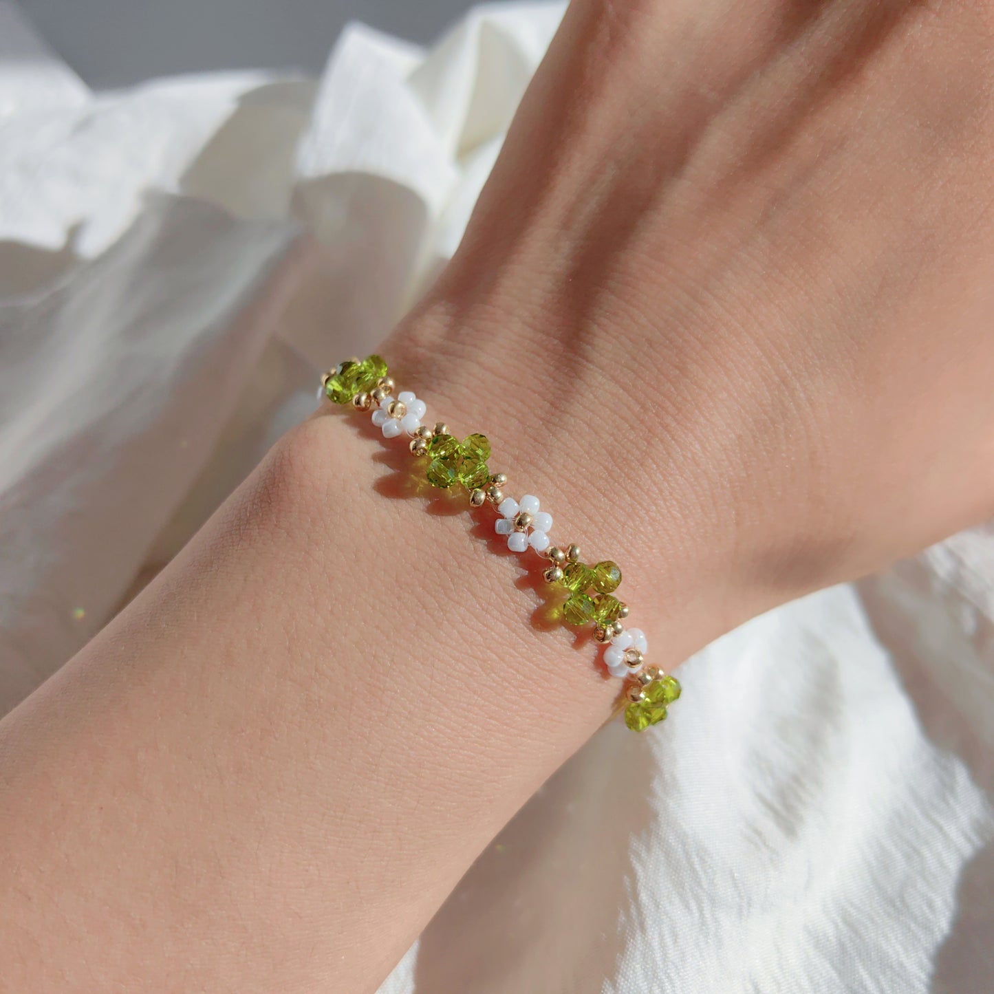 Light green Crystal & White Seed Bead Bracelet worn on wrist