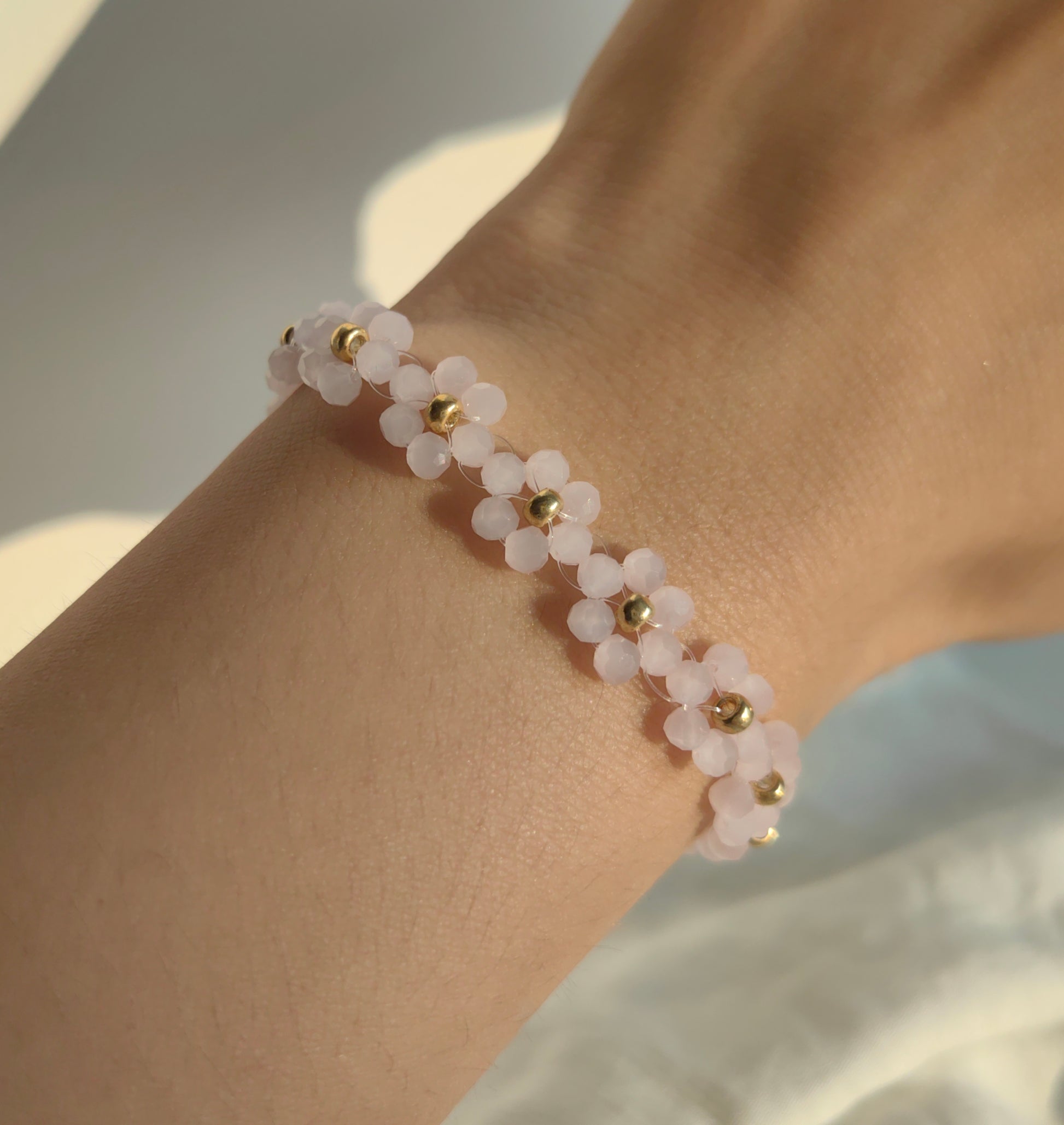 Light pink Deamy Bead Bracelet worn on wrist, handmade Earth seed beads