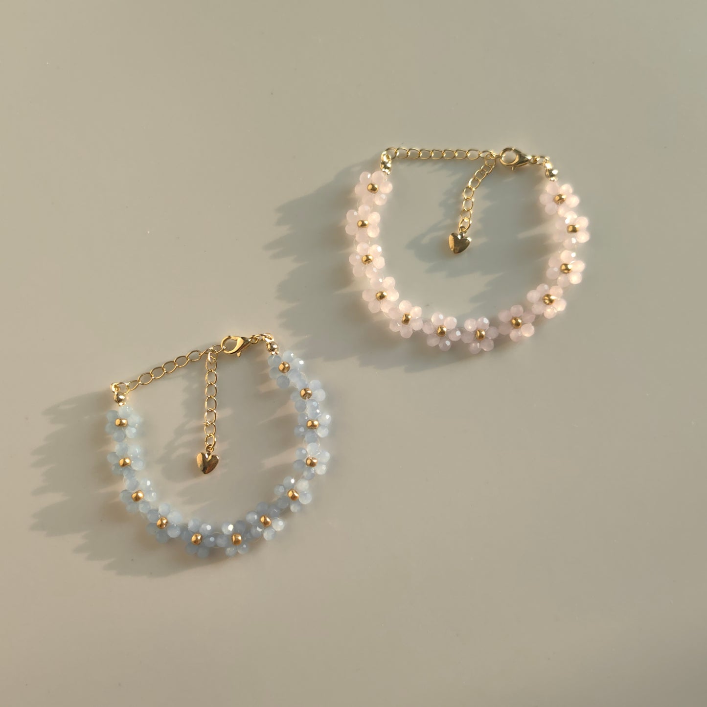 Dreamy Bead Bracelets in light blue and pink on white background, handmade Earth seed beads