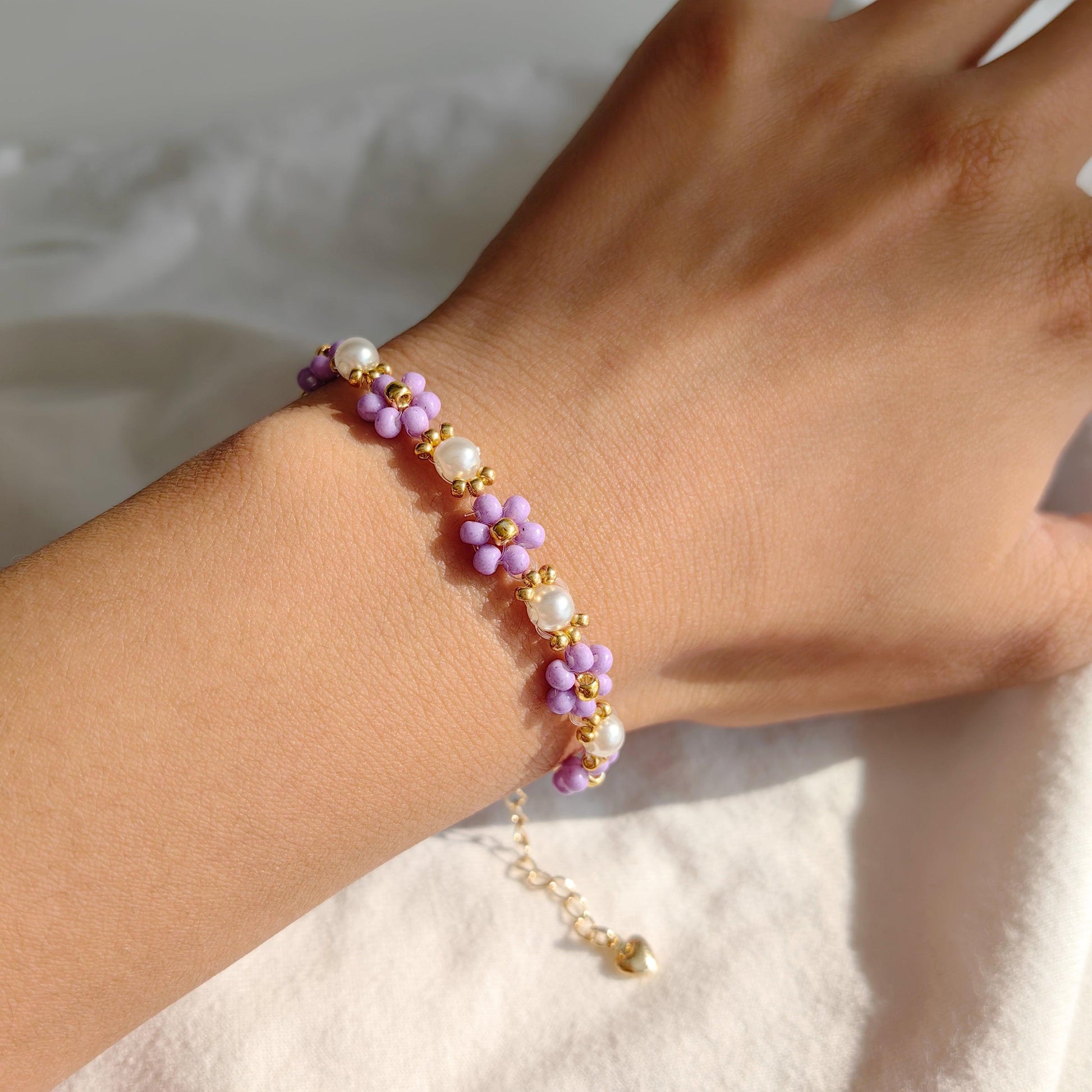 Purple Pearl Blossom pearl and seed bead bracelet worn on wrist