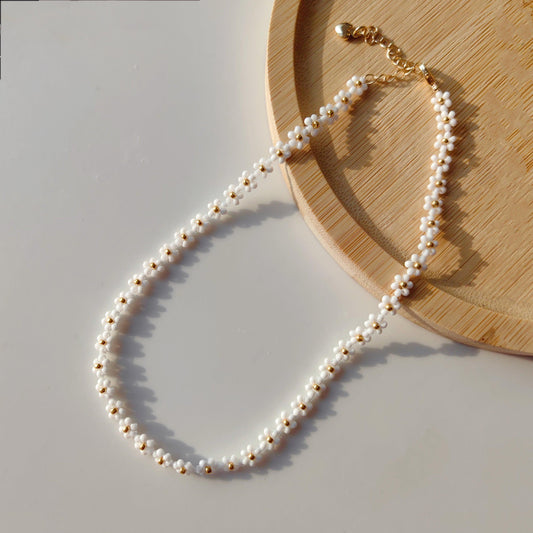 White Daisy Necklace displayed in a wooden tray, dainty white seed bead floral necklace