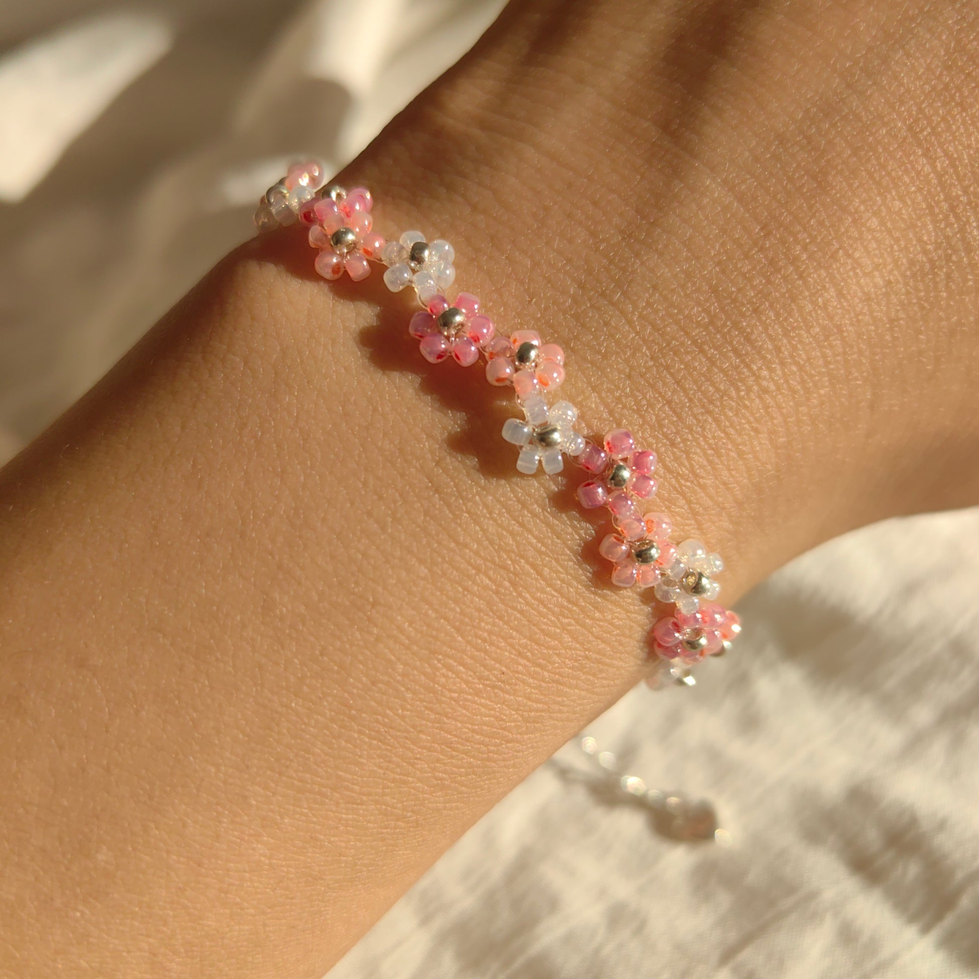 Zigzag Fairy Bracelet worn on wrist, cute pink and white seed bead bracelet