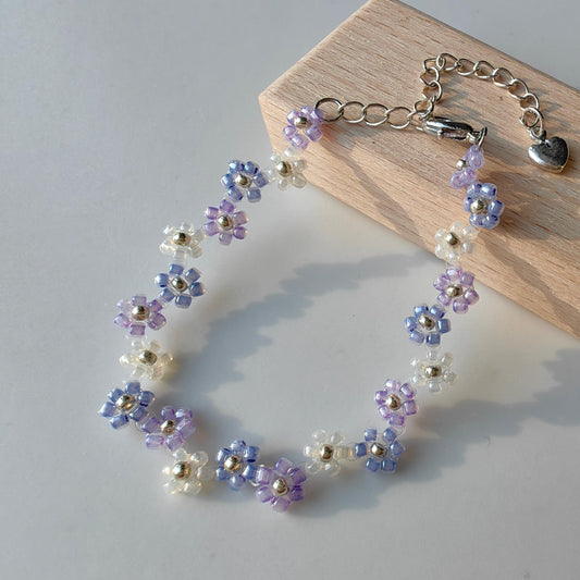 Zigzag Lavender Bracelet displayed on wood, blue purple and white seed bead bracelet
